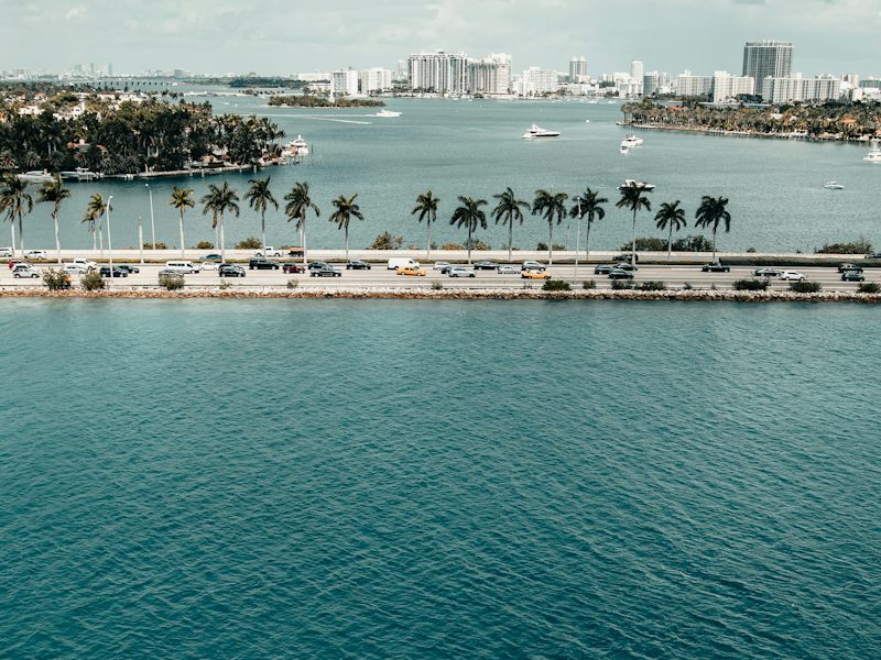 Palm-lined island estates on Biscayne Bay with the Miami skyline behind