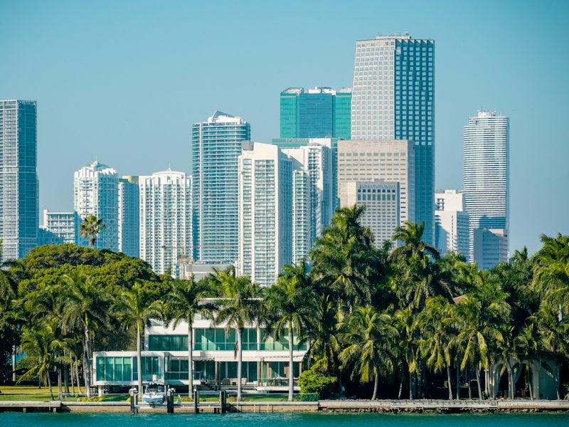 Waterfront mansion and palm trees on Star Island, Miami