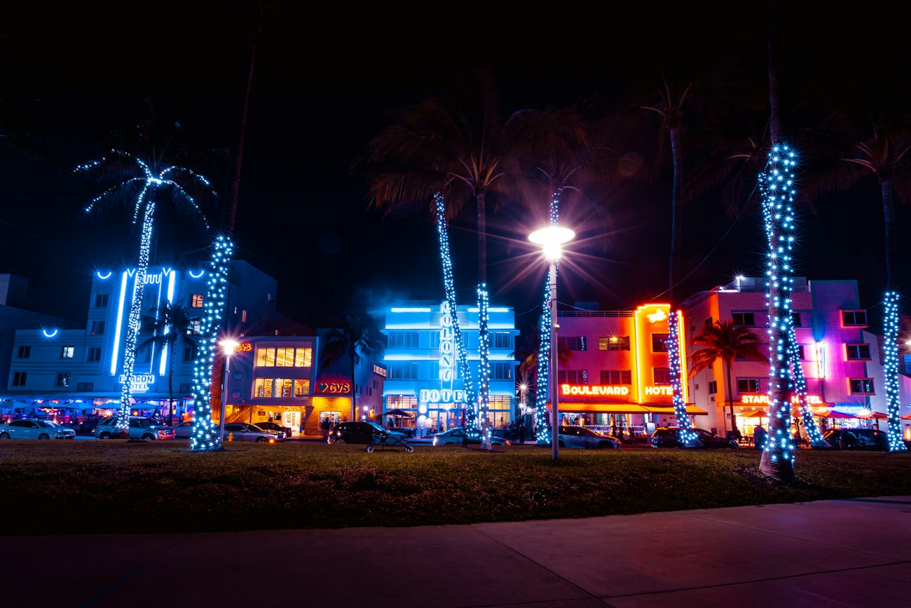 Ocean Drive neon signs and palm trees at night, Miami Beach