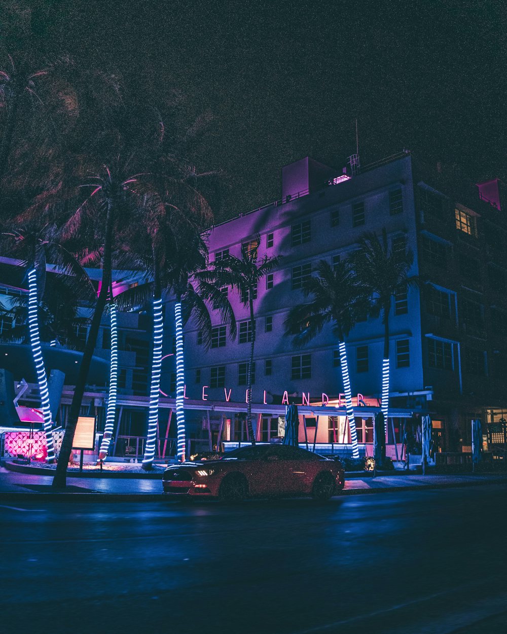 Neon-lit Art Deco hotels on Ocean Drive, Miami Beach, at night